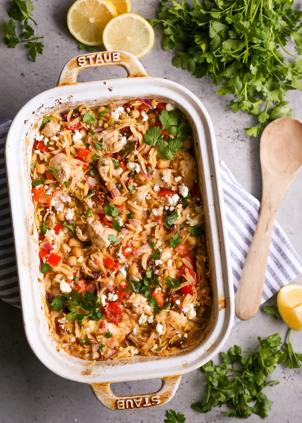 Easy Mediterranean chicken orzo casserole with chickpeas, feta, and fresh herbs, a healthy one-pan dinner recipe.