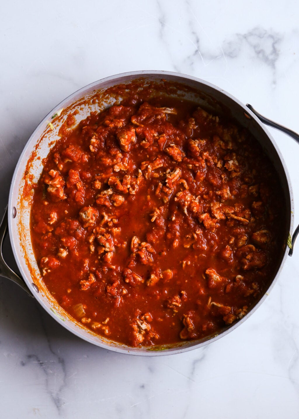 Easy unstuffed cabbage casserole with ground turkey in tomato marinara sauce, hearty dinner.