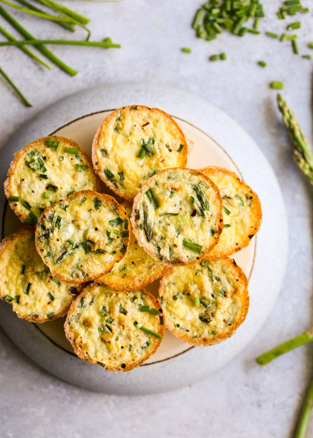 Asparagus and feta egg muffins: baked mini egg bites with asparagus and feta for a high-protein breakfast meal prep.