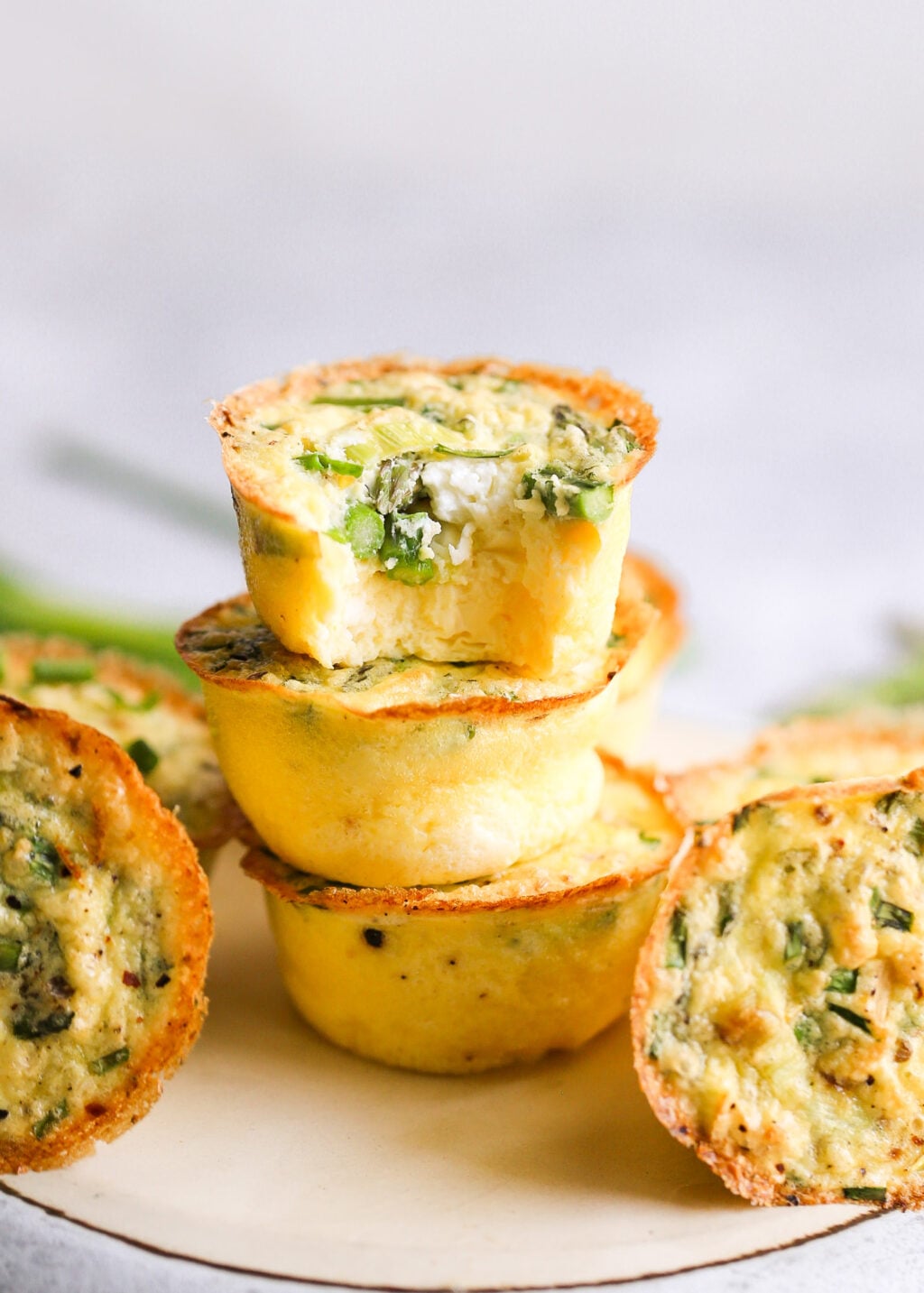 Asparagus and feta egg muffins baked in mini cups—high-protein breakfast recipe, perfect for meal prep or brunch.
