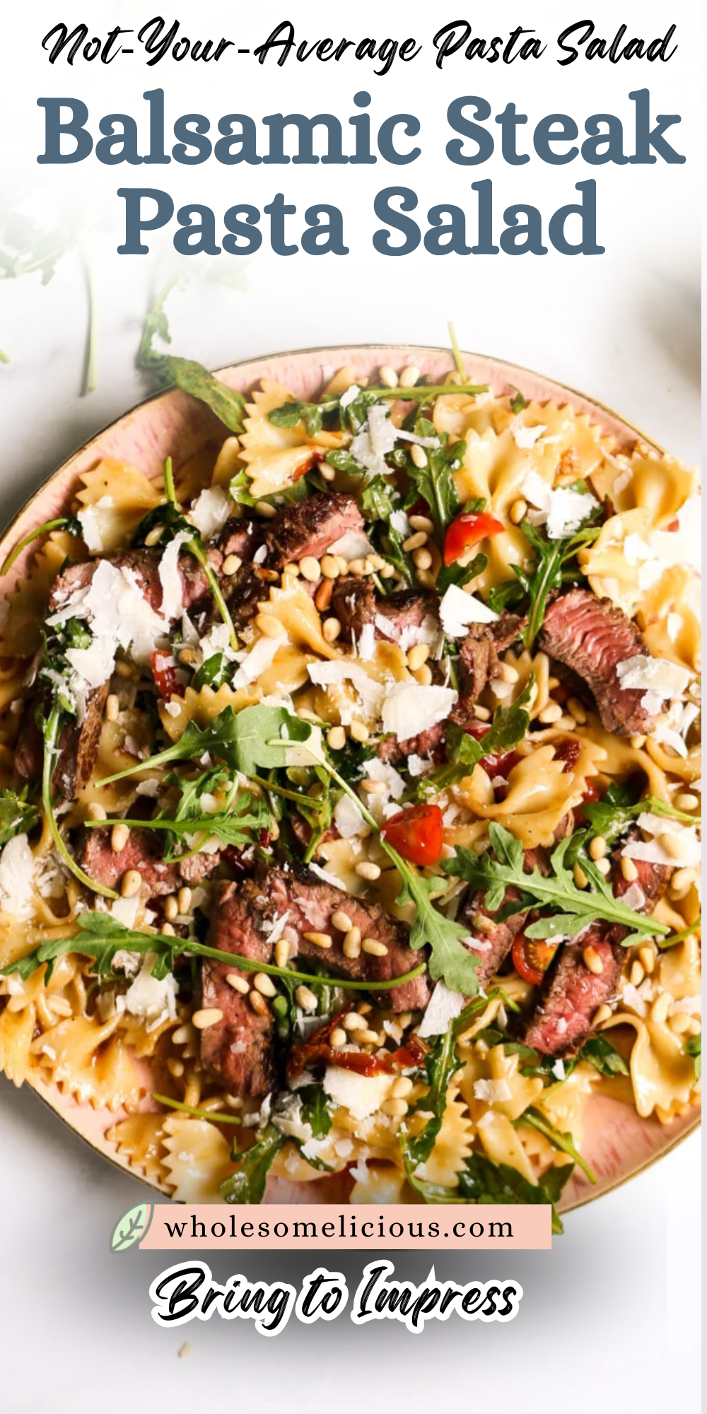Balsamic steak pasta salad with arugula, shaved parmesan, and pine nuts on a pink plate—tasty dinner recipe.
