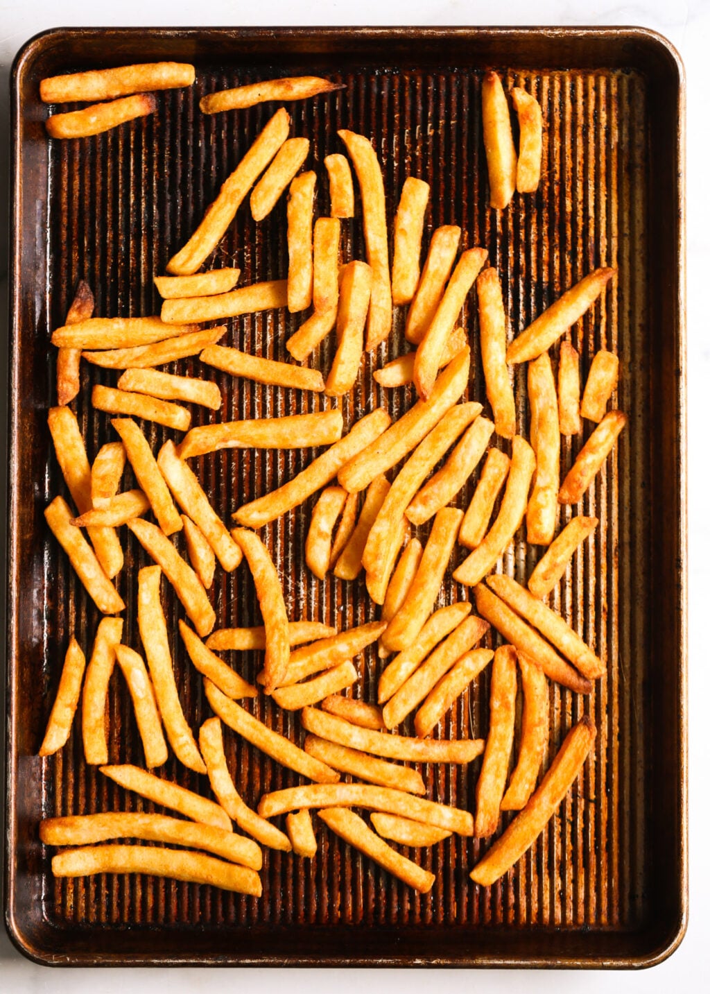 Oven‑baked sweet potato fries for healthy beef burger bowls.