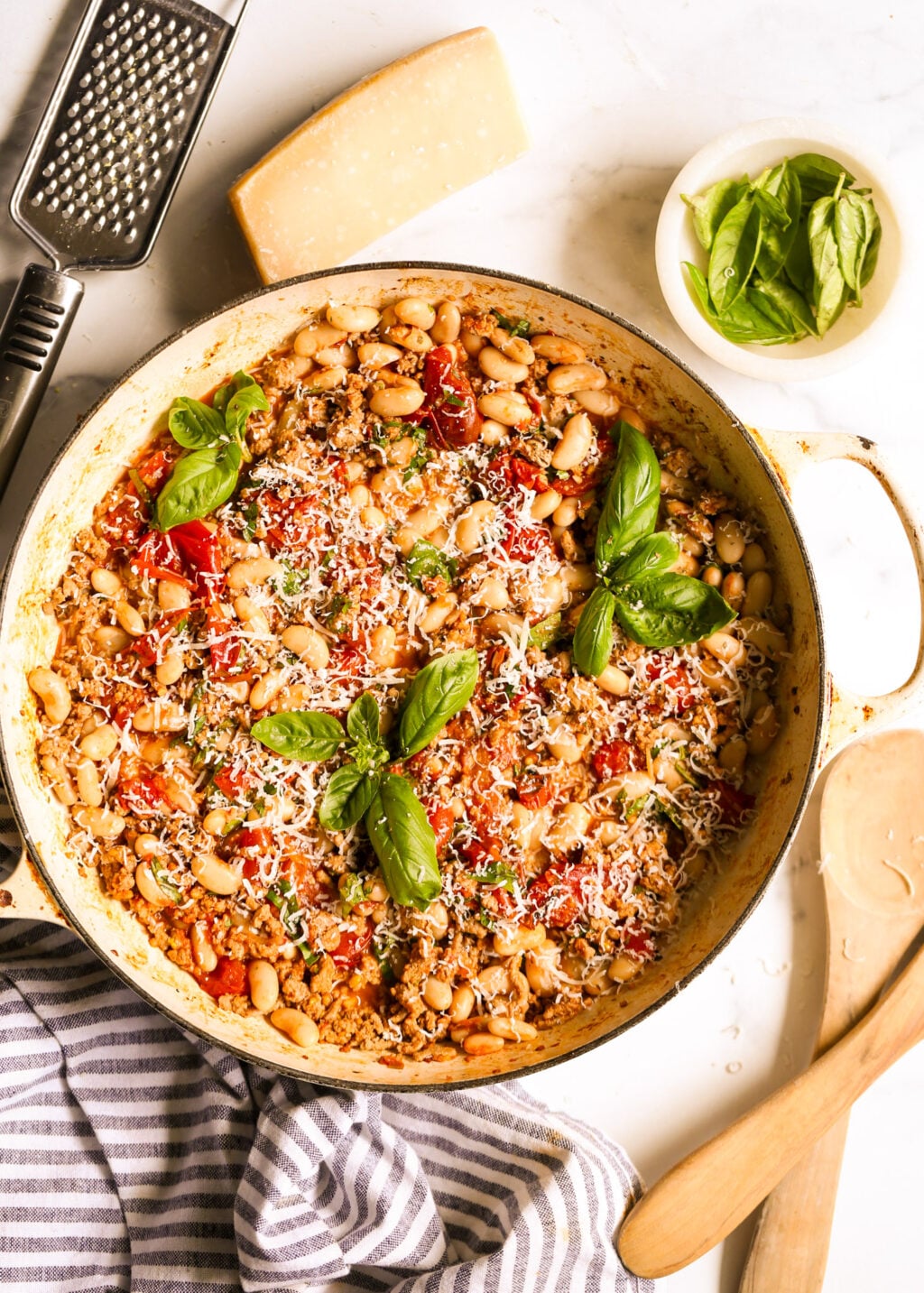 Turkey and white bean skillet cooked with tomatoes, herbs, and seasonings for an easy high‑protein dinner.